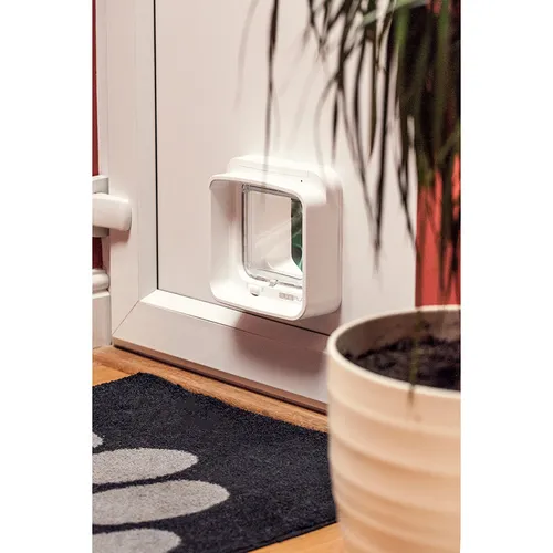SureFlap microchip cat flap fitted neatly into a white uPVC door panel