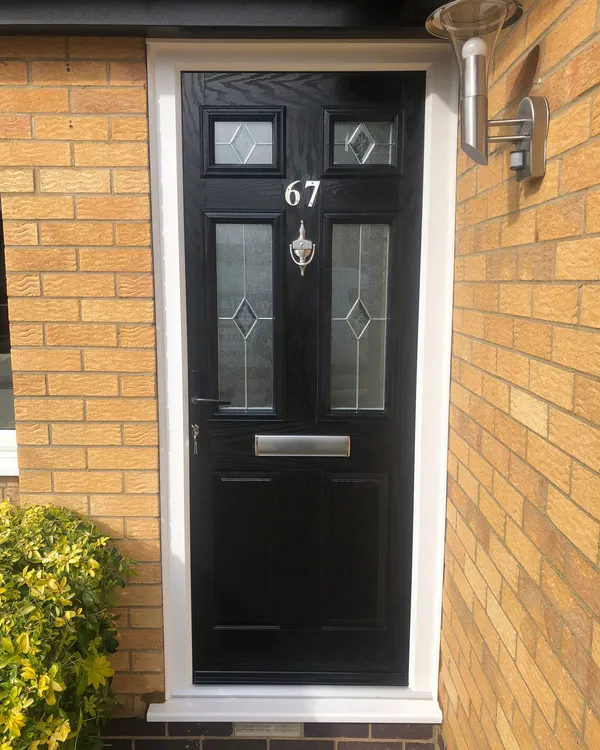 Black composite front door with diamond decorative glass and chrome knocker