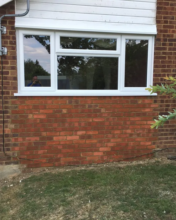White UPVC casement window installed in a brick property