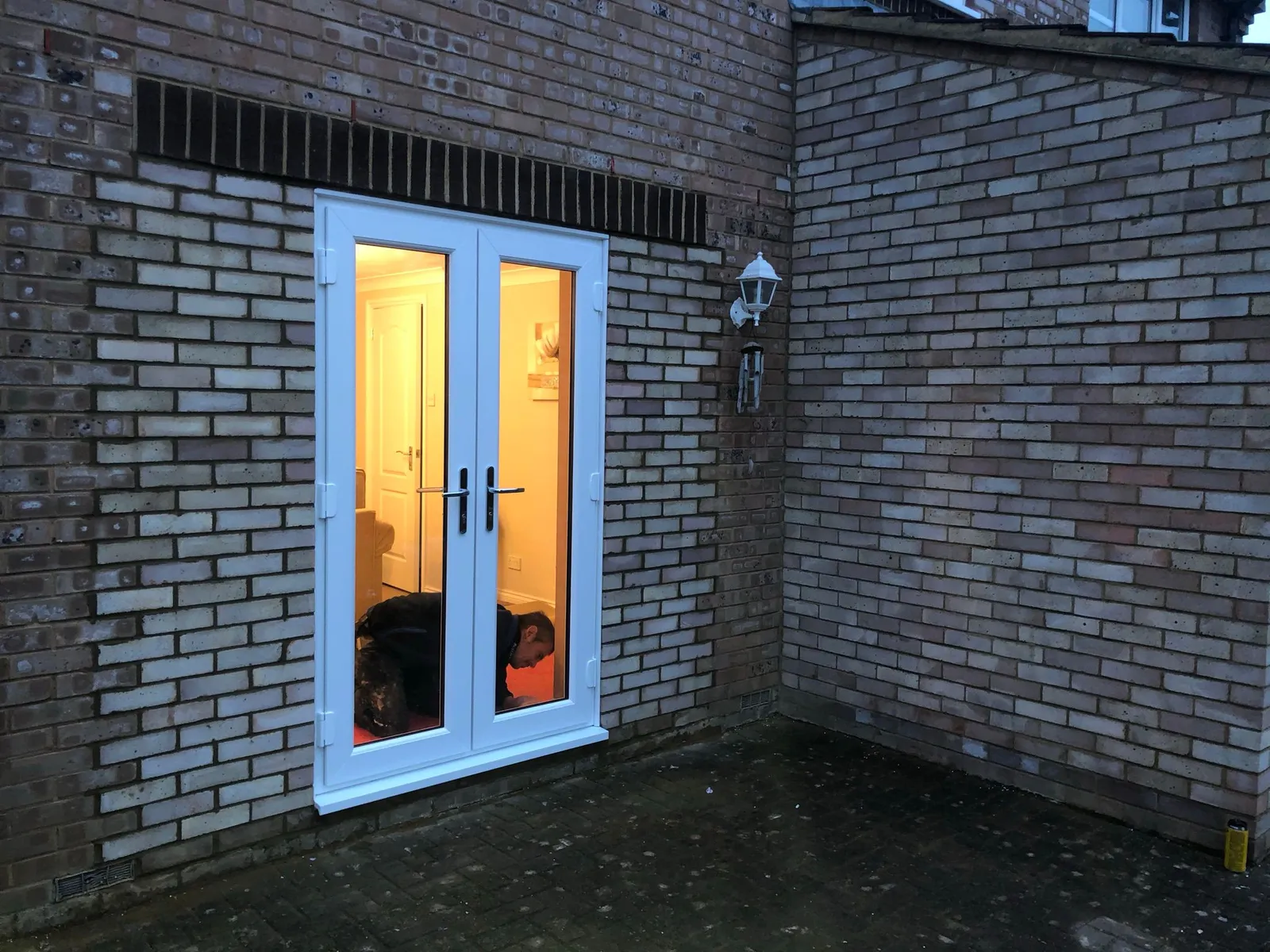 White UPVC French doors opening to garden area