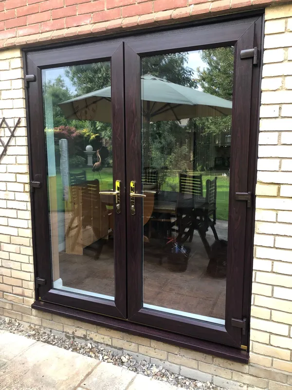 Dark woodgrain UPVC French Doors fitted in Northampton