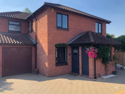 Full house dark-framed UPVC Windows and matching entrance door