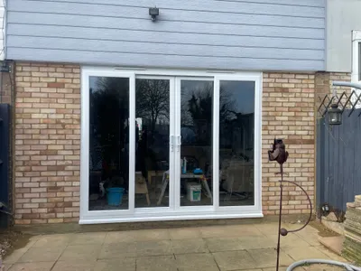 Large white uPVC sliding patio doors with full glass panels.